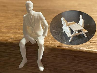 Small Sitting Man After Work