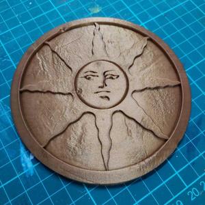 texturized and battered Sun Medal