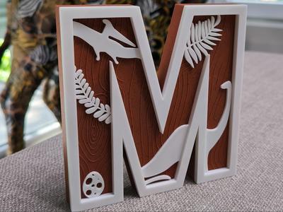Wood style letters with dinosaurs.