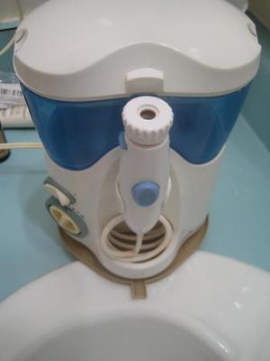 Inclined waterpik stand