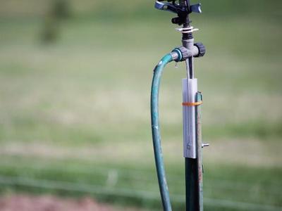 Mount for Impulse Sprinkler on Green Metal U Post