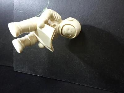 An astronaut reading a book.   