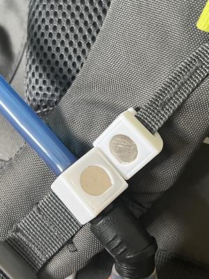 Magnetic clip for a bladder/platypus