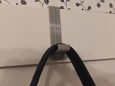 Hook for Ikea Pax wardrobe door. 