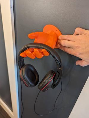Wall mountable headphone hand stand