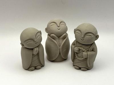 Three Monk Figurines