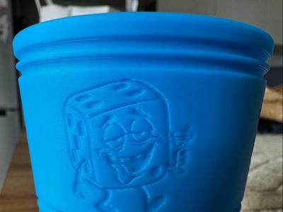 Dice cup with funny dice embossing