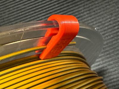 Bi-directional filament clip