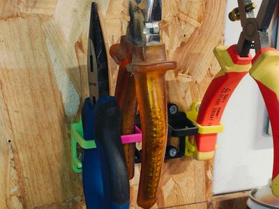 Wall-mounted clamp holder