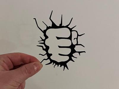 Hulk's fist goes through the wall