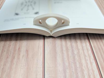 Bookside holder, book page holder