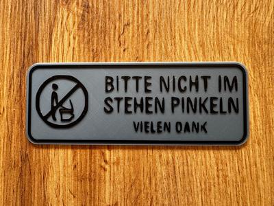 WC sign – Please urinate while seated