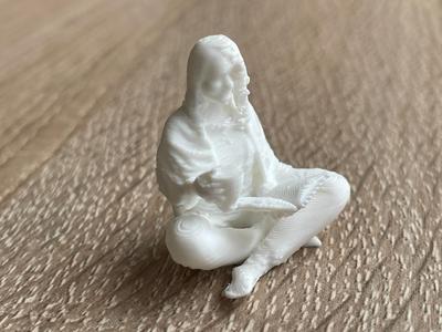 Small seated woman reading