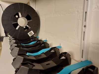 PTFE holder used for the injection molded Spool holder - R4 with the hole relocated and rotated.