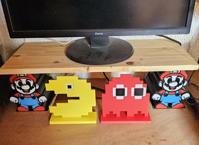 Retro gaming- Pacman and ghost with eyes and support