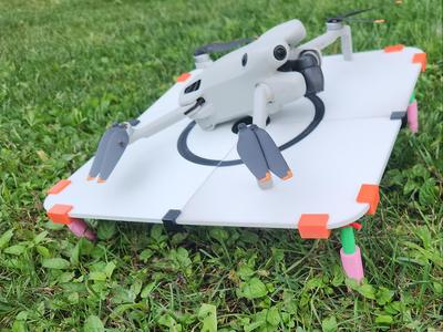 Drone landing pad with adjustable legs