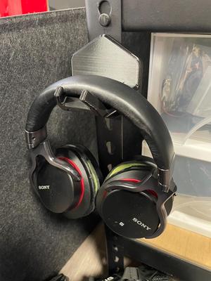 Hook with over-ear headphones
