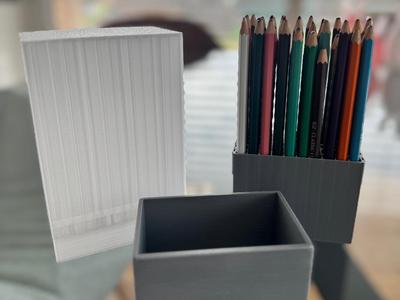 Housing with cover for colored pencil container