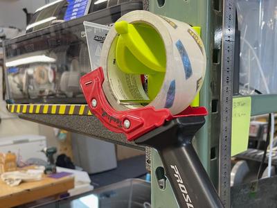 Pallet rack tape roll/gun hanger