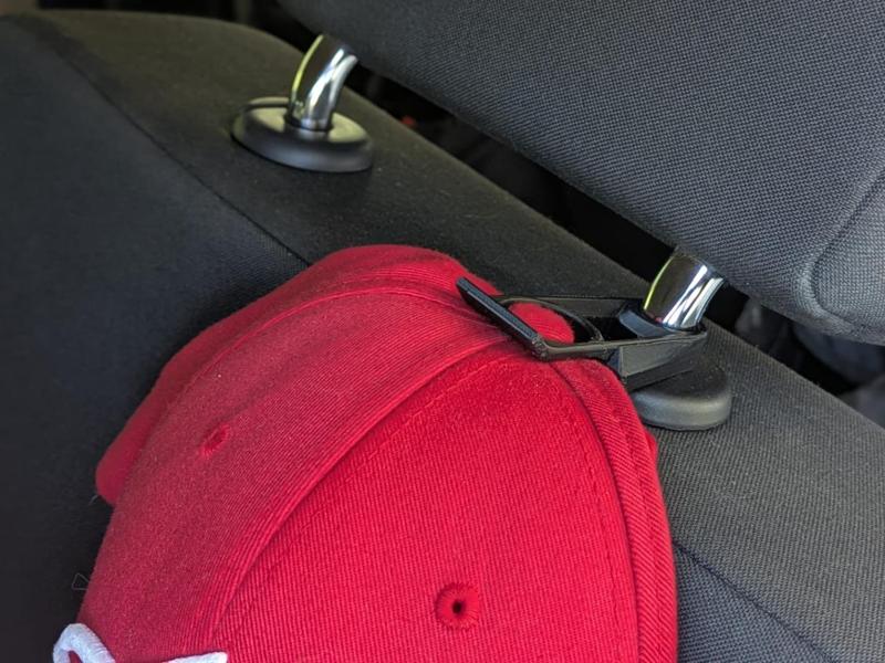Car headrest cap holder