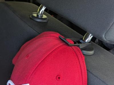 Car headrest cap holder