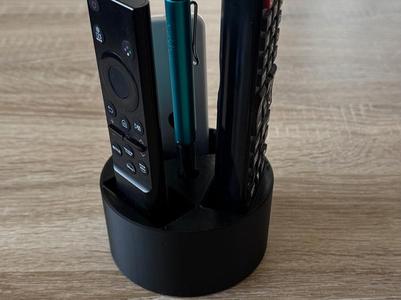 Remote control holder with pen holder