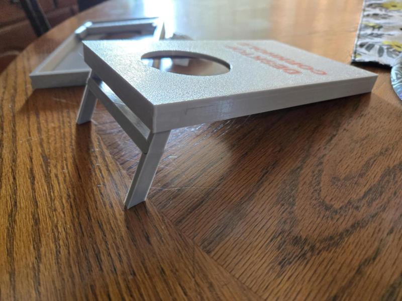 Table top cornhole with desiccant pouches
