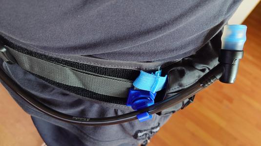 Magnetic clip for hydration backpacks or hippacks