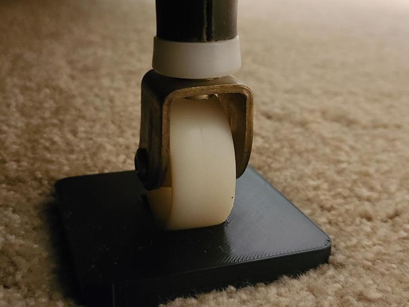 Furniture coaster with wheel indent