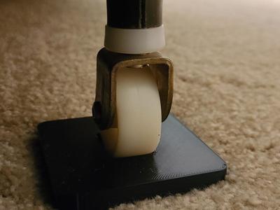 Furniture coaster with wheel indent