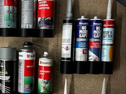 Caulking tube wall holder 