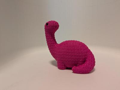 Cute wool knitted dinosaur textured