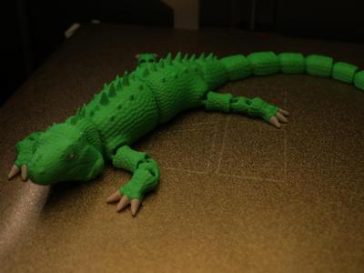 Articulated iguana lizard