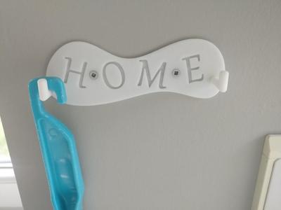 Hook for brush and kitchen washbassed