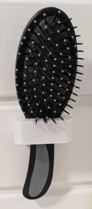 Hairbrush wall holder