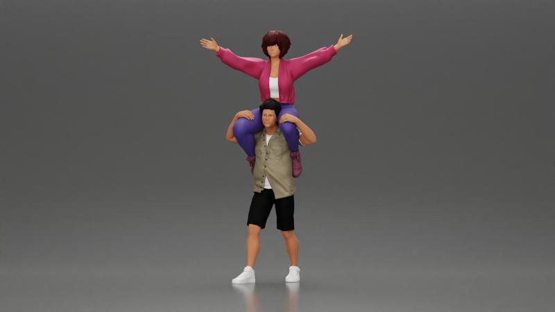 Man in shorts carrying girlfriend on shoulders girl being carried on the man's shoulders