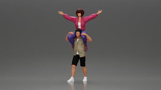 Man in shorts carrying girlfriend on shoulders girl being carried on the man's shoulders