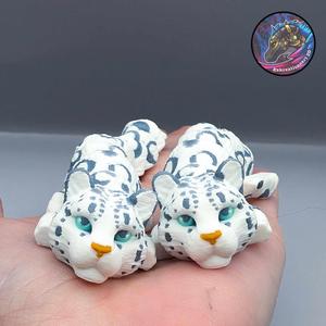 baby flexi snow leopard keychain