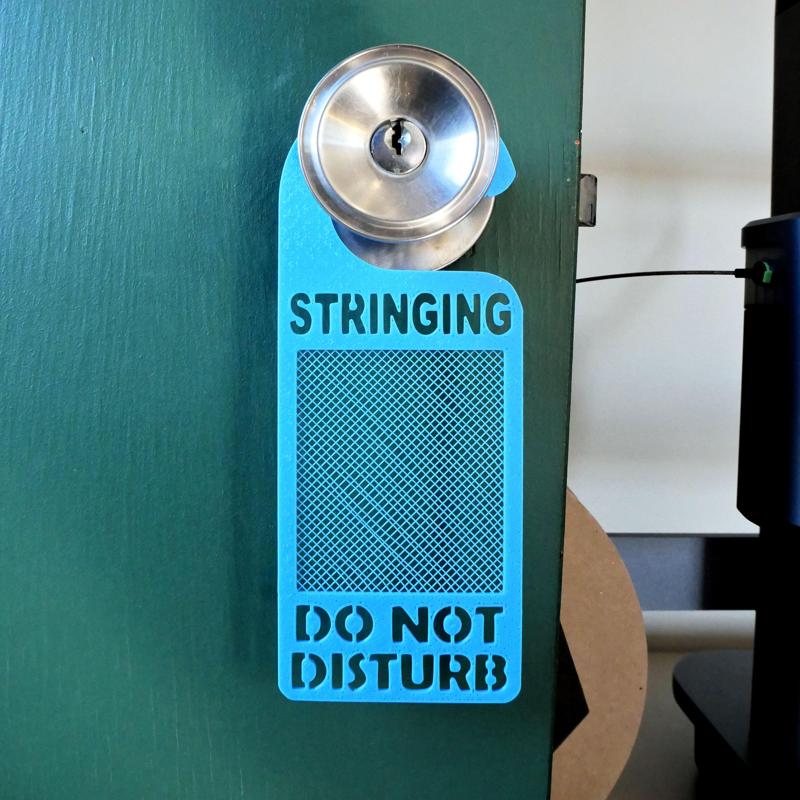 Stringing Do Not Disturb Sign