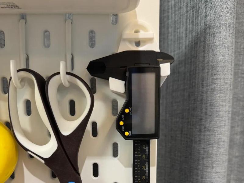 My personal favorite IKEA pegboard caliper storage rack, including mounting hardware