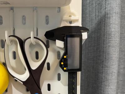 My personal favorite IKEA pegboard caliper storage rack, including mounting hardware