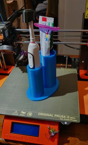 Oral B iO Toothbrush and paste holder.