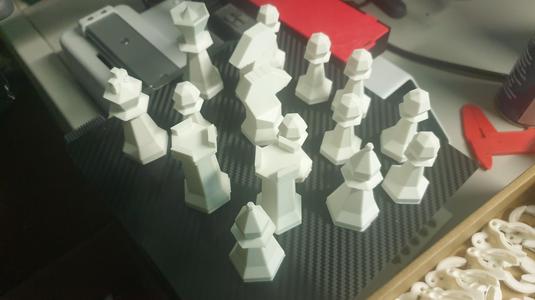 Low poly chess pieces shaped to have sort of a "hand carved" style