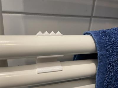 Anti slip (snap in) for washcloth on bathroom radiator