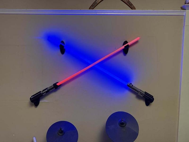 Adjustable lightsaber wall mounts