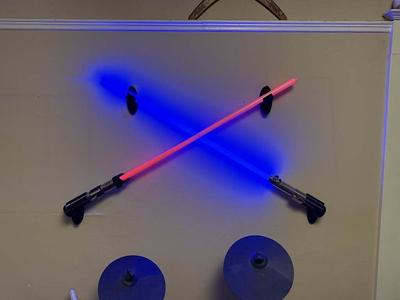 Adjustable lightsaber wall mounts