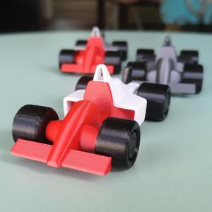 keychain, phone holder and formula 1 car toy