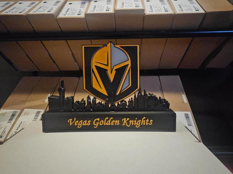 Vegas Golden Knights with skyline of Vegas NHL