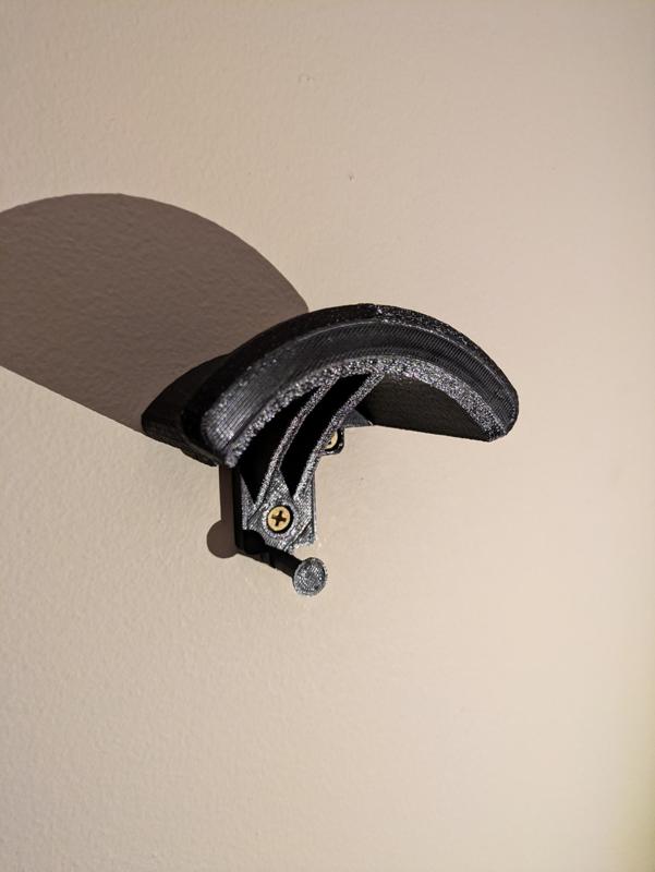 Motorcycle wall helmet holder