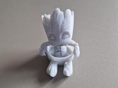 mini groot inside a pot